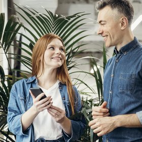smiley-coworkers-looking-each-other