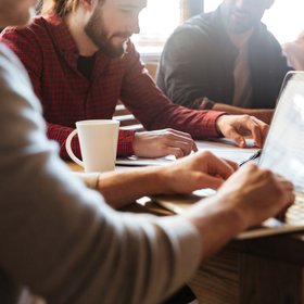 concentrated-colleagues-sitting-office-coworking